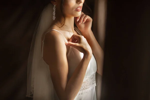 Beautiful bride at home. Woman posing by the window. — Stock Photo, Image