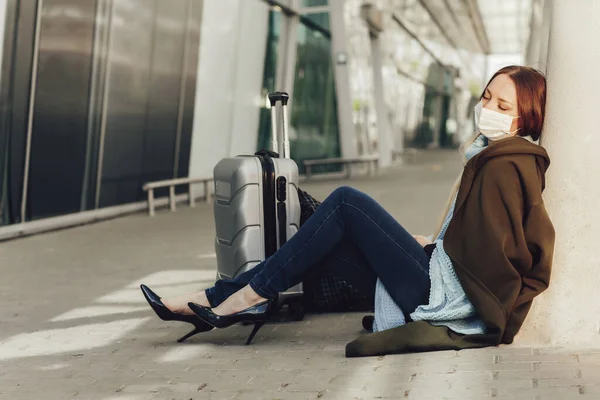 Young Woman Medical Mask Sits Luggage Airport Tortured Flight Woman Jogdíjmentes Stock Képek