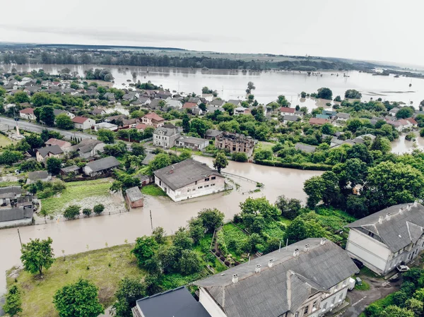 Aerial view of the flooded city of Halych, Western Ukraine. Flood on the Dniester River, flooded streets and houses in Halych. Global catastrophe, climate change, flood concept.
