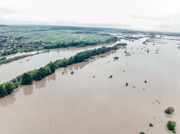 Flood on the Dniester River. Flooded village of Galich. Fields in dirty water. Natural disasters, rains and floods.