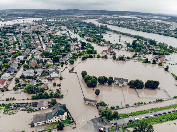Aerial view of the flooded village of Halych, Prykarpattia. The flood on the Dniester River caused a natural disaster. Flooded houses and streets, evacuation of people.