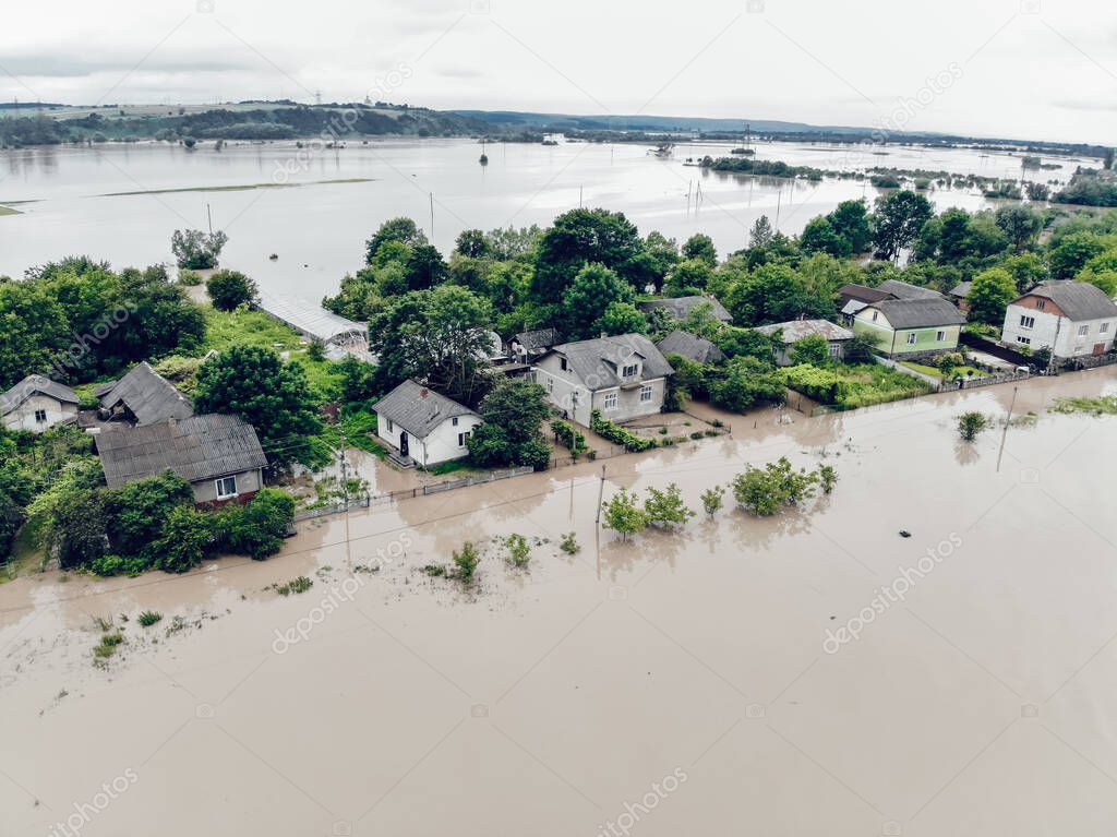 Climate change and the effects of global warming. Flooded houses, streets, farms and fields after heavy rains. Environmental natural disaster. Concept of global catastrophes in the world.