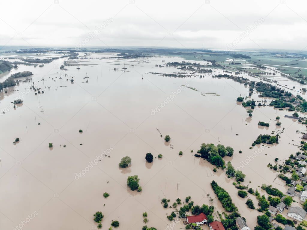 Climate change and the effects of global warming. Flooded village, farms and fields after heavy rains. Environmental natural disaster. Concept of global catastrophes in the world.