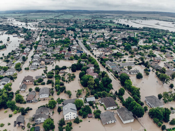 Climate change and the effects of global warming. Flooded village after heavy rains. Environmental natural disaster. Concept of global catastrophes in the world.