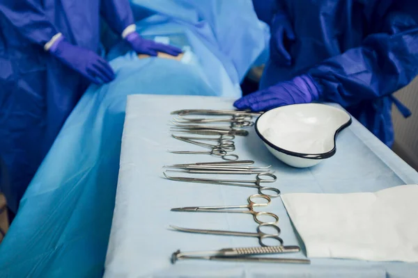 Close-up of surgical instruments in the operating room on the table. Preparation for surgery. Sterile instruments