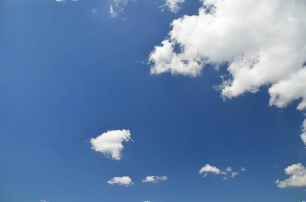 Blue sky with white clouds. Texture/Background