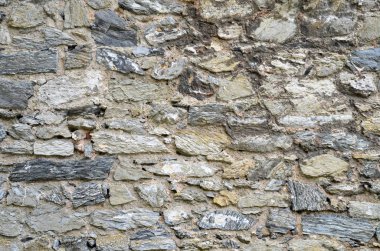 Antika doğal stonewall. Eski taş doku/arka plan. Kale duvarı