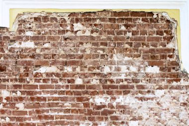 Old red brick laying on the background of a restored wall clipart