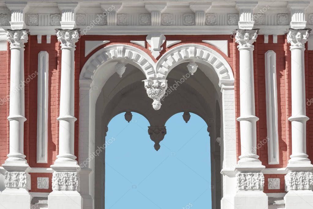 Architectural building with arches, stucco, pilasters.