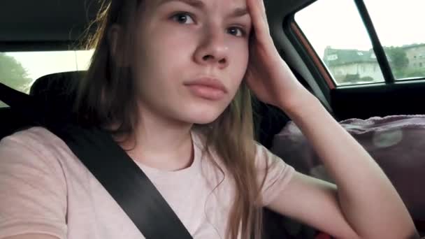 Girl Sitting Back Seat Car Wearing Seatbelt Resenting Something Thinking — Stock Video