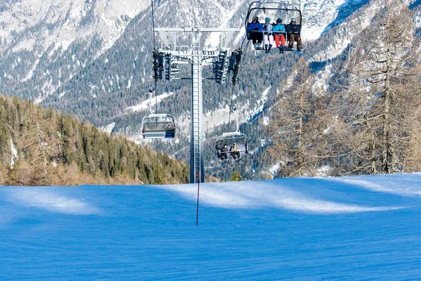 Ski resort Folgarida Marilleva.Folgarida Marilleva.Italy.15.02.2019. People rise on a chair lift. — Stock Photo, Image