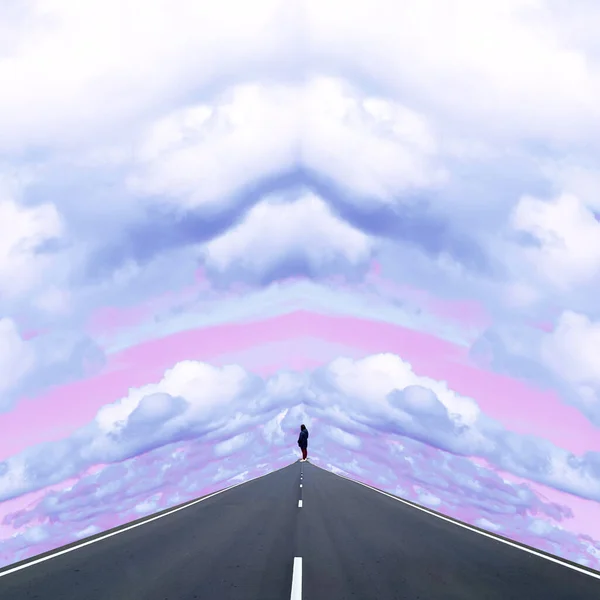Contemporary collage. A man stands on an empty road and looks into the distance against the background of the sky. Travel concept, abstraction, art, freedom. — Stock Photo, Image