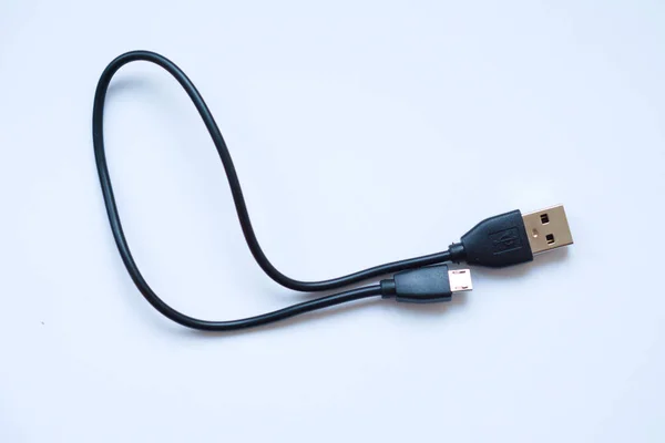 USB to mini-USB black cable on a white background