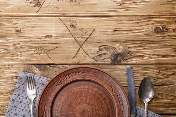 old cutlery on wooden table