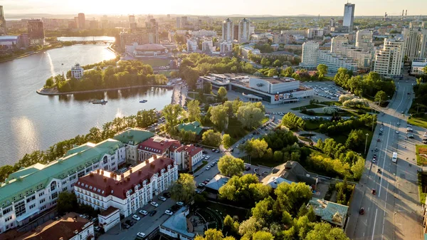 The central pond of the city. Cinema-concert theater Cosmos. Sunset. Aerial view (drone). Yekaterinburg, Russia