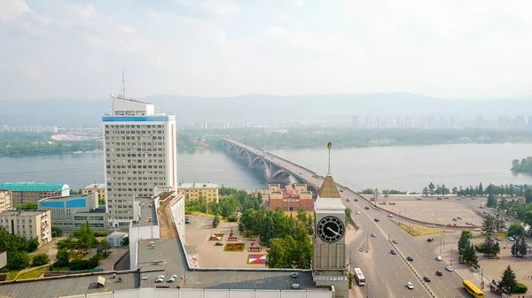 The city clock. Communal bridge, the city administration. Panorama of the city of Krasnoyarsk. Russia, From Dron