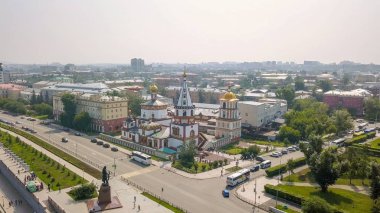 Russia, Irkutsk. Cathedral of the Epiphany. Embankment of the Angara River, Monument to the Founders of Irkutsk. The text on the Russian - Irkutsk, From Dron   clipart