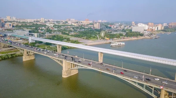 Russia, Novosibirsk - July 19, 2018: Metro Bridge and Communal Bridge. Panorama of the city of Novosibirsk. View on the river Ob. Russia, From Dron — Stock Image Russia Novosibirsk July 2018 Metro Bridge Communal Bridge Panorama City Stock Image