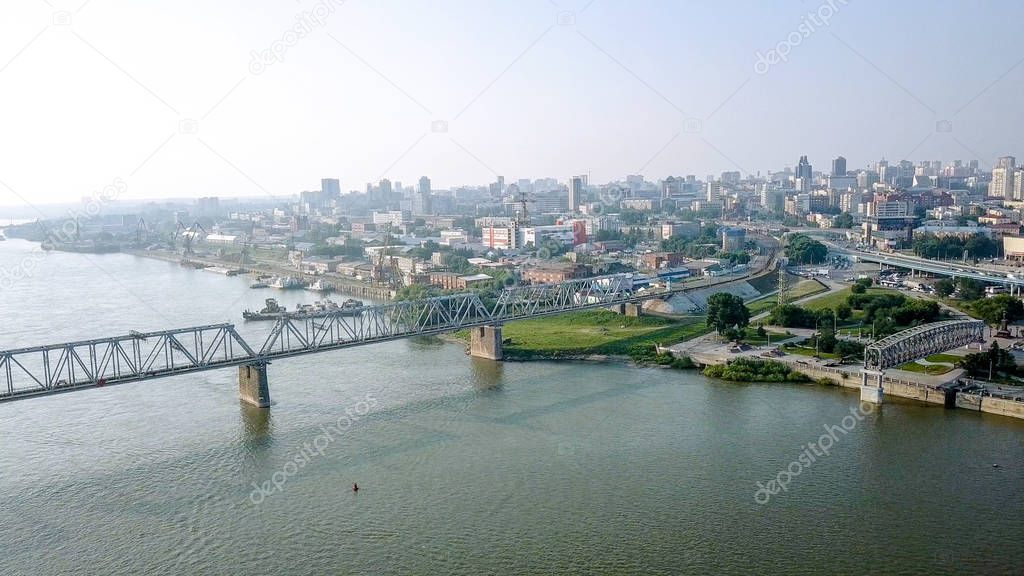 First Railway Bridge in Novosibirsk. Panorama of the city of Novosibirsk. View on the river Ob. Russia, From Dron  