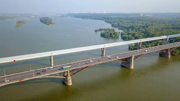 Metro Bridge and Communal Bridge. Panorama of the city of Novosibirsk. View on the river Ob. Russia, From Dron — Stock Image Metro Bridge and Communal Bridge. Panorama of the city of Novosibirsk. View on the river Ob. Russia, From Dron Stock Photo