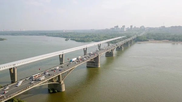 Metro Bridge and Communal Bridge. Panorama of the city of Novosibirsk. View on the river Ob. Russia, From Dron — Stock Image Metro Bridge and Communal Bridge. Panorama of the city of Novosibirsk. View on the river Ob. Russia, From Dron Stock Image