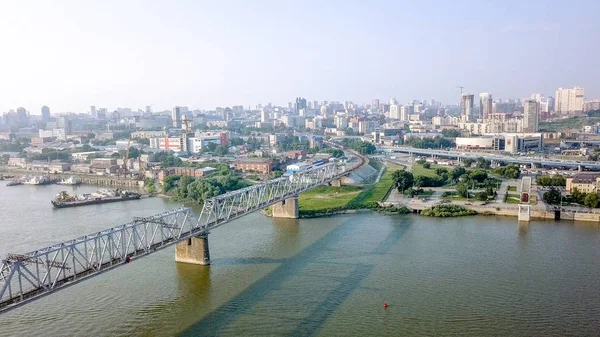 First Railway Bridge in Novosibirsk. Panorama of the city of Novosibirsk. View on the river Ob. Russia, From Dron — Stock Image First Railway Bridge in Novosibirsk. Panorama of the city of Novosibirsk. View on the river Ob. Russia, From Dron Stock Picture