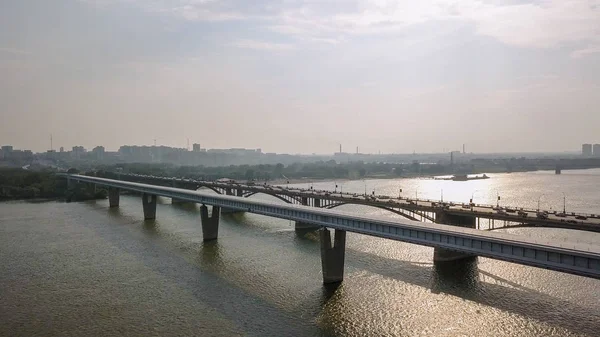 Metro Bridge and Communal Bridge. Panorama of the city of Novosibirsk. View on the river Ob. Russia, From Dron — Stock Image Metro Bridge and Communal Bridge. Panorama of the city of Novosibirsk. View on the river Ob. Russia, From Dron Stock Photo