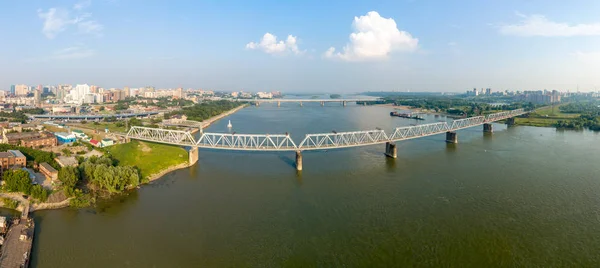 First Railway Bridge in Novosibirsk. Panorama of the city of Nov — Stock Image First Railway Bridge in Novosibirsk. Panorama of the city of Nov Stock Photo