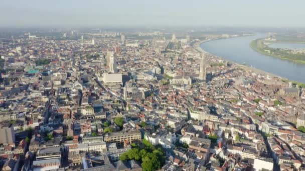 Antwerp, Belgium. Flying over the roofs of the historic city. Schelde (Esco) river. 4K — Stock Video