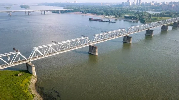 First Railway Bridge in Novosibirsk. Panorama of the city of Novosibirsk. View on the river Ob. Russia, From Dron — Stock Image First Railway Bridge in Novosibirsk. Panorama of the city of Novosibirsk. View on the river Ob. Russia, From Dron Stock Picture