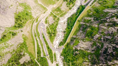Switzerland. Picturesque winding mountain road with tunnels Gotthardstrasse, Aerial View, HEAD OVER SHOT 