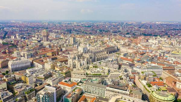 Milan, Italy. Roofs of the city aerial view. Spiers Milan Cathedral. Cloudy weather., Aerial View 