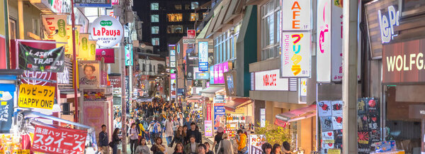 Harajuku, Tokyo, Japan - 31 Oct 2018: The Harajuku. People, mostly youngsters, walk through Takeshita Street, a famous shopping street lined with fashion boutiques, cafes and restaurants in Harajuku in Tokyo, Japan.