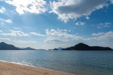 The beach of Okunoshima ( Rabbit Island ) in the Seto Inland Sea. Hiroshima prefecture, Japan. clipart