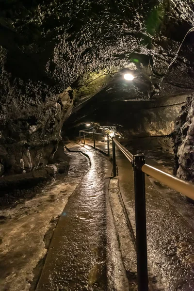 Wind Cave & Ice Cave in Fugaku Japan. The Fuji Fugaku Wind Cave is surrounded by the abundant greenery of the Aokigahara Jukai forest. Once you enter the cave, it is pleasantly cool even in summer