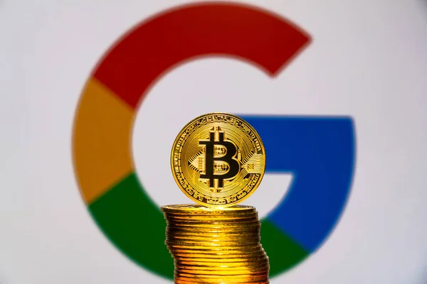 stock image Gold Bitcoin coins with the Google logo on background screen. TOKYO, JAPAN - JULY 4, 2019