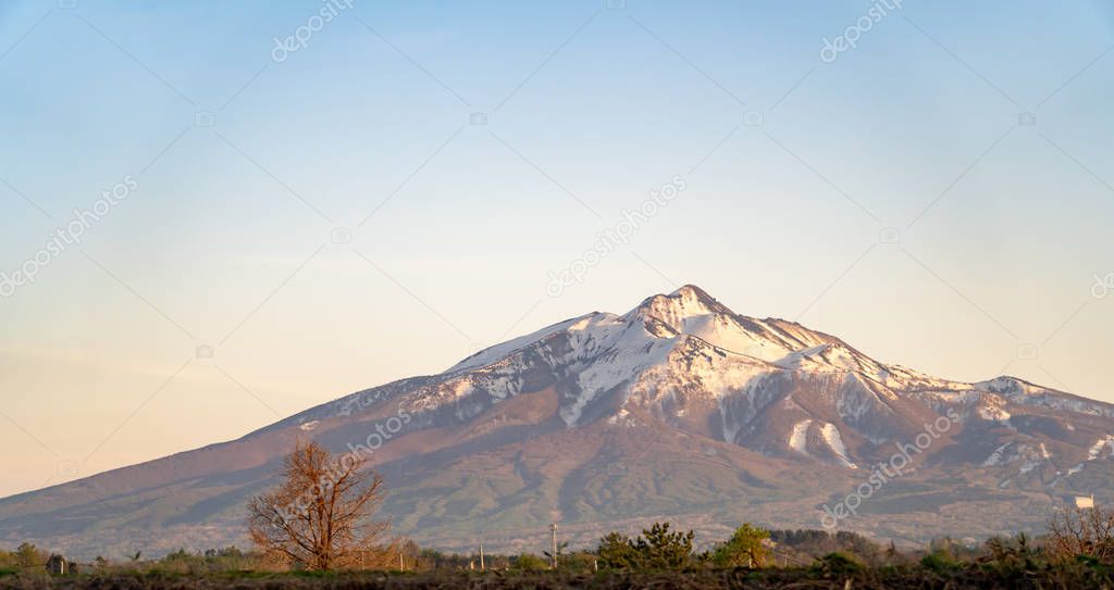 Mount Iwaki on sun set time, a stratovolcano located in western Aomori Prefecture, Tohoku, Japan. It is also referred to as Tsugaru-Fuji due to its shape.