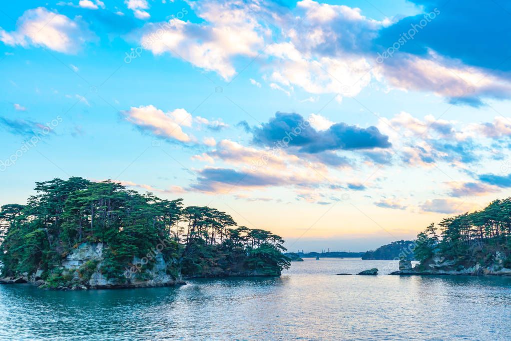 Matsushima Bay in dusk, beautiful islands covered with pine trees and rocks. One of the Three Views of Japan, and is also the site of the Zuigan-ji, Entsu-in and Kanrantei. in Miyagi Prefecture, Japan