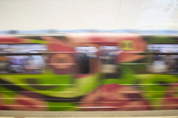 Blurred motion of the colorful train in an underground station.