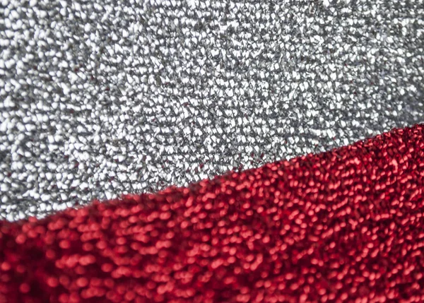 Silver and red glittery shimmering background with blinking details.