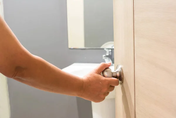 Hand man open the door bathroom — Stock Photo, Image