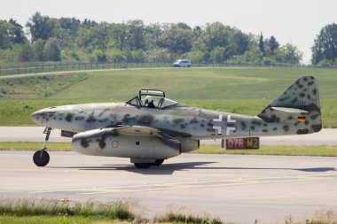 BERLIN, GERMANY - MAY 22, 2014: Messerschmitt Me 262 taxiing before it's flying display at the International Aerospace Exhibition ILA. clipart