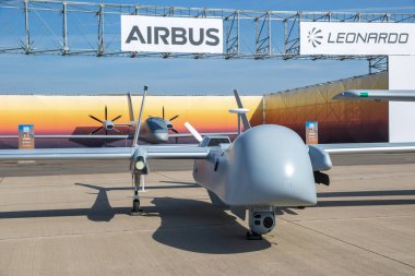 BERLIN, GERMANY - APR 27, 2018: Airbus EADS Harfang armed military UAV drone on display at the Berlin ILA Air Show. clipart
