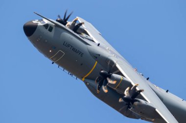 WUNSTORF, GERMANY - JUNE 9, 2018: German Air Force (Luftwaffe) Airbus A400M military transport plane in flight. clipart