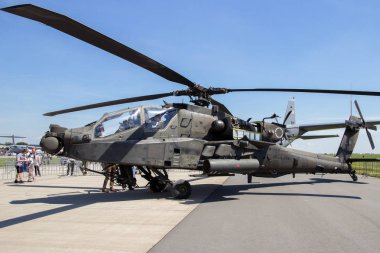 BERLIN, GERMANY - MAY 22, 2014: US Army Boeing AH-64D Apache Longbow attack helicopter at the International Aerospace Exhibition ILA. clipart