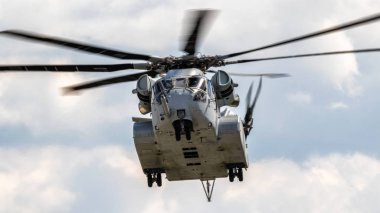 BERLIN - APR 27, 2018: New Sikorsky CH-53K King Stallion heavy-lift helicopter of the US Marines in action at the Berlin ILA Air Show. clipart