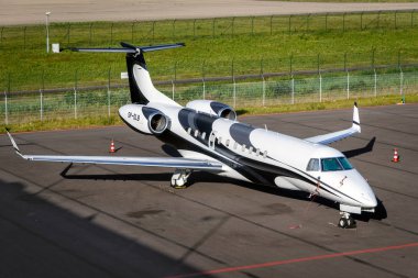 EINDHOVEN, THE NETHERLANDS - JUN 22, 2018:  Embraer EMB-135BJ Legacy 600 business jet from Jet Story on the tarmac of Eindhoven Airport. clipart