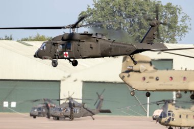 EINDHOVEN, THE NETHERLANDS - JUN 22, 2018: United States Army Sikorsky UH-60 Blackhawk transport helicopter taking off. clipart