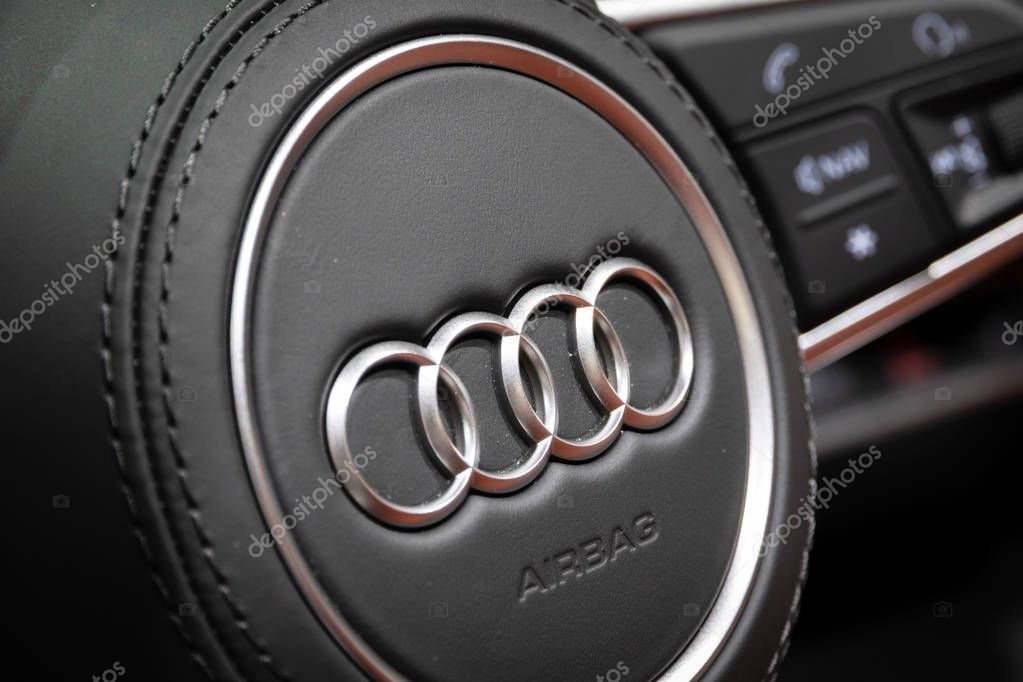 PARIS - OCT 3, 2018: Audi logo on the steering wheel of the new Audi TT sports car interior at the Paris Motor Show.