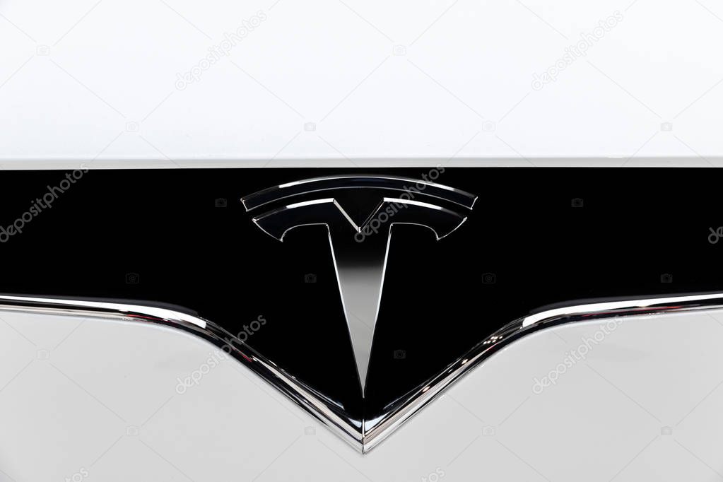 BRUSSELS - JAN 18, 2019: Tesla logo on the front of a Tesla Model X electric luxury crossover suv car showcased at the 97th Brussels Motor Show 2019 Autosalon.
